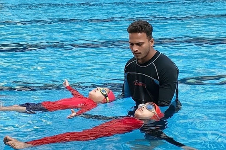 Kids swimming in pool